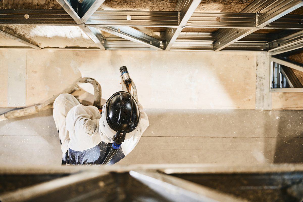 Closed-cell foam insulation being sprayed into a HOWMZ floor cassette
